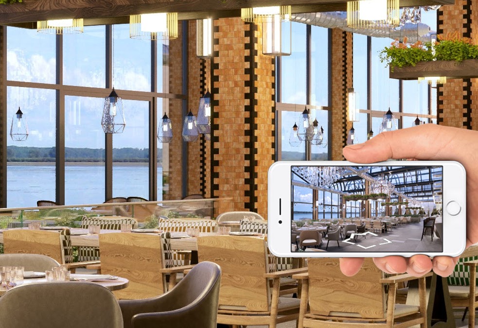 A hand holds a white smartphone displaying a 360-degree virtual tour interface of a restaurant interior.